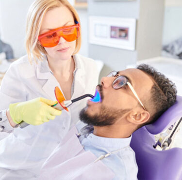 Brantford dentist doing teeth whitening to their patient