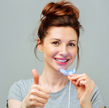 Girl with a long lasting teeth whitening
